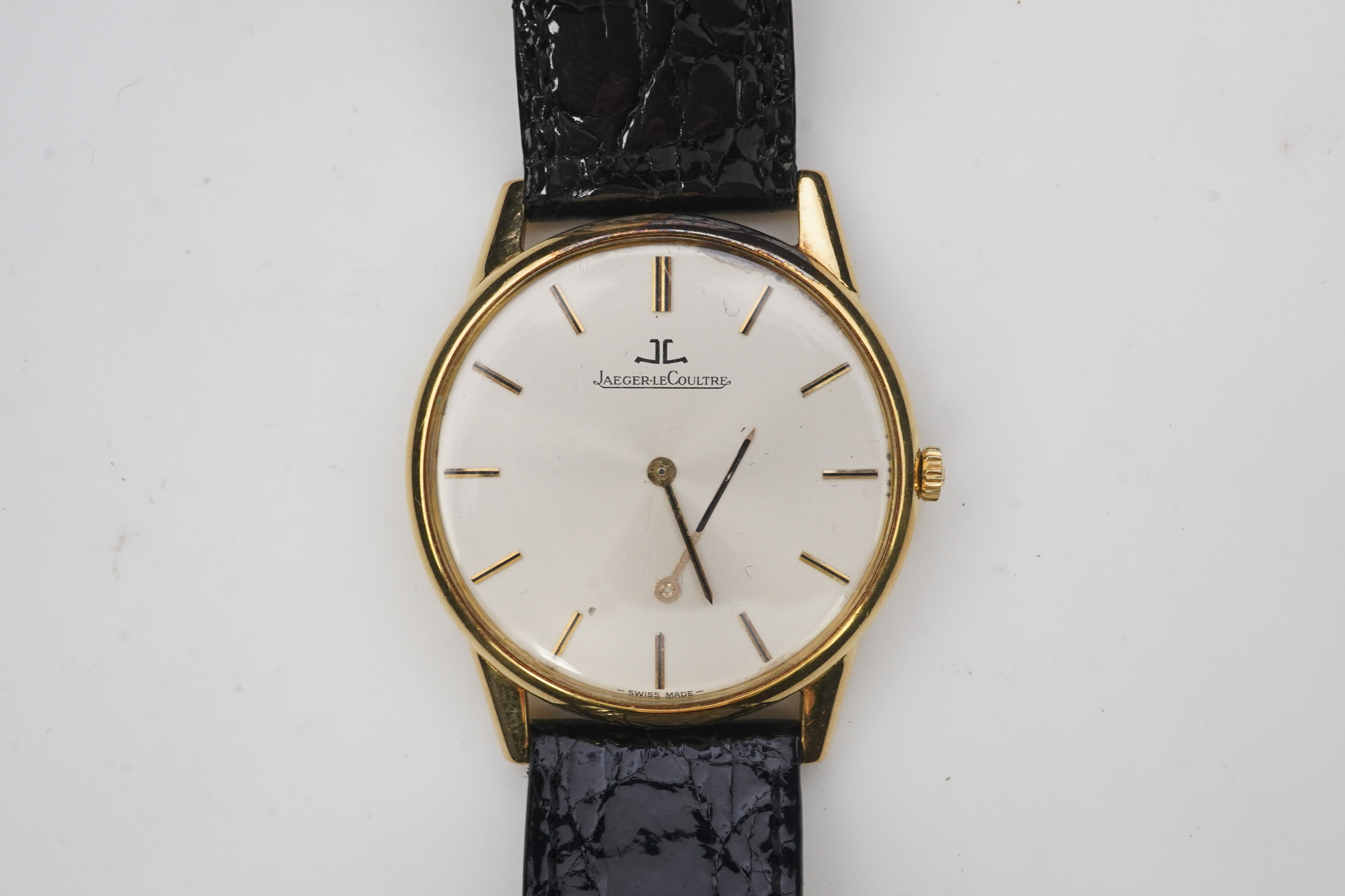 A gentleman's 18ct gold Jaeger LeCoultre manual wind dress wrist watch, on a later associated leather strap